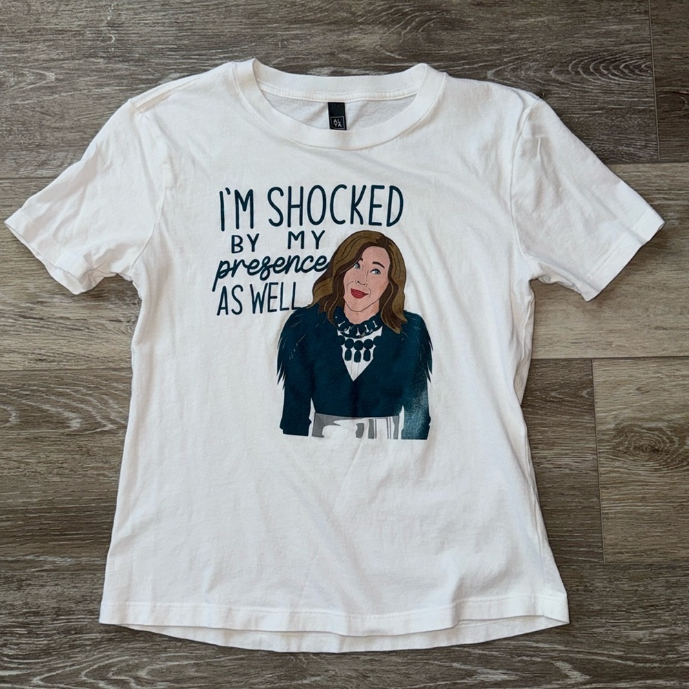 Schitt’s Creek Tee Shirt “I’m Shocked by my presence as well” Moira Rose